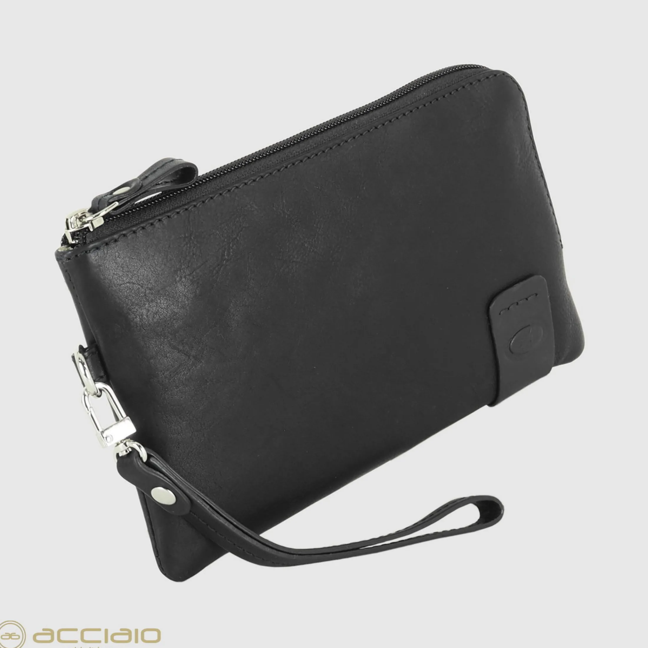 pochette_uomo_piccola_in__2-3.webp Pochette Uomo piccola in pelle borsello a mano Thomas 7" Nero