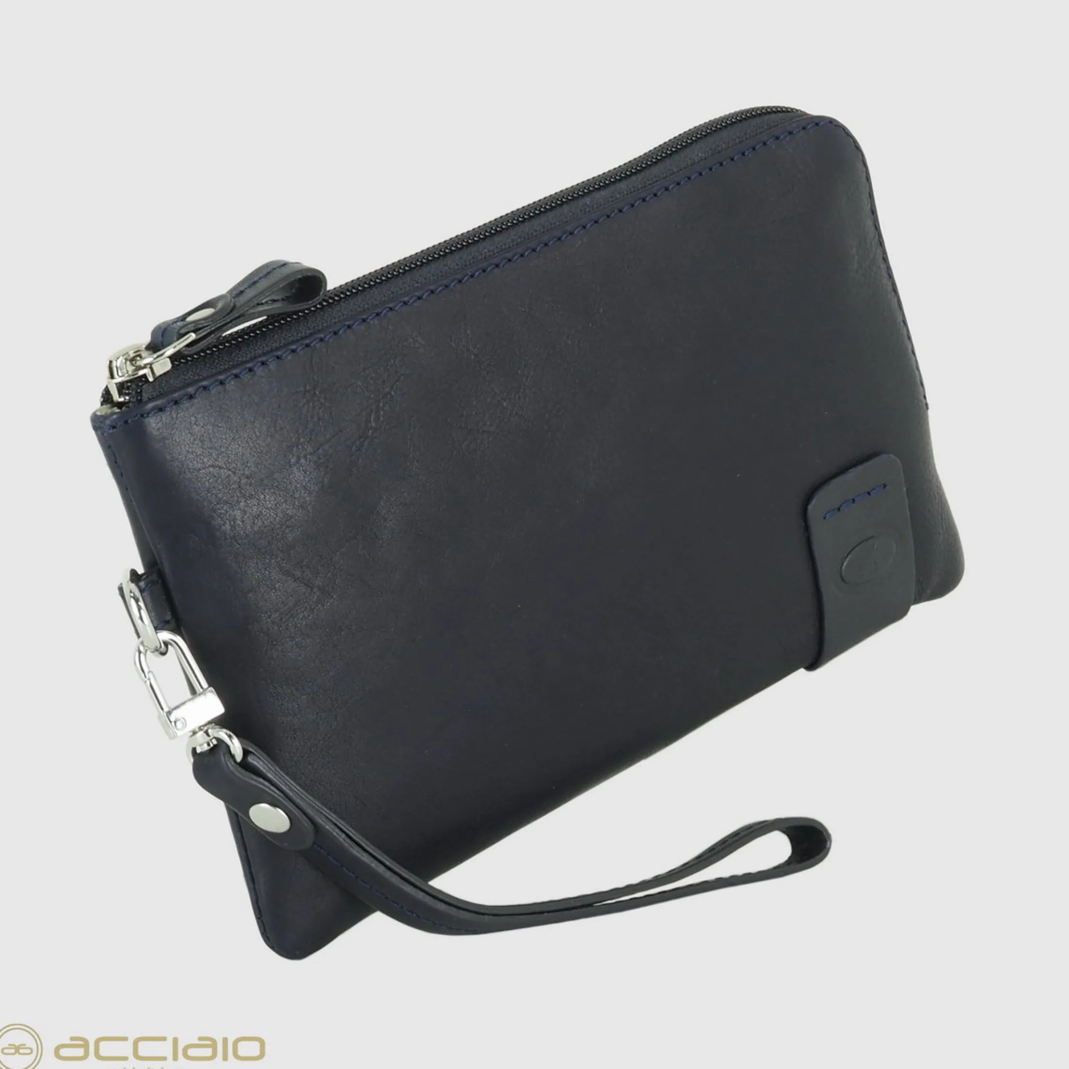 pochette_uomo_piccola_in__2.webp Pochette Uomo piccola in pelle borsello a mano Thomas 7" Blu